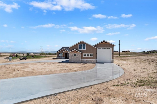 view of front facade with a garage, board and batten siding, and concrete driveway