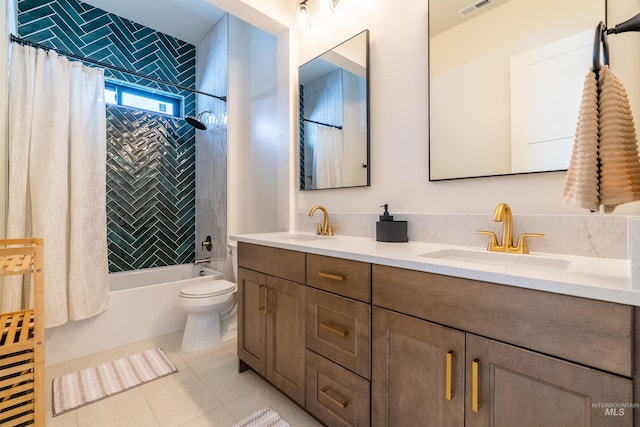 bathroom featuring visible vents, double vanity, shower / bath combo, tile patterned floors, and a sink