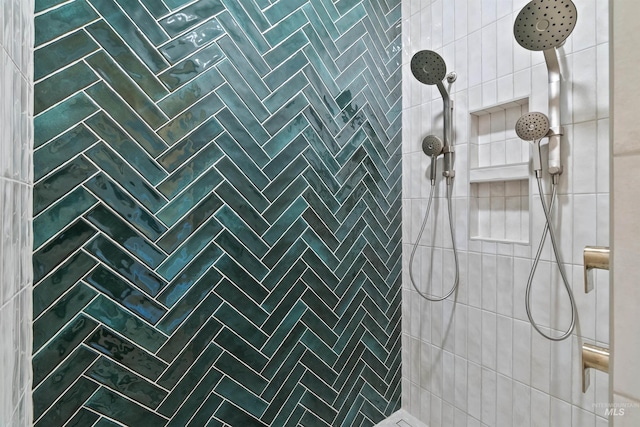 full bath featuring a tile shower