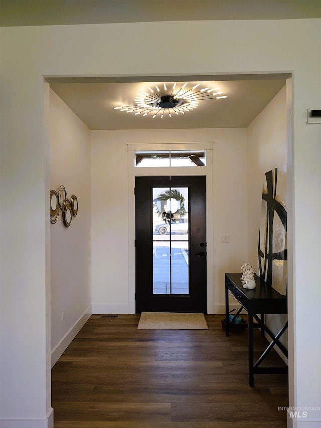 entryway with dark wood-type flooring