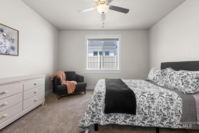 bedroom featuring carpet flooring, baseboards, and ceiling fan