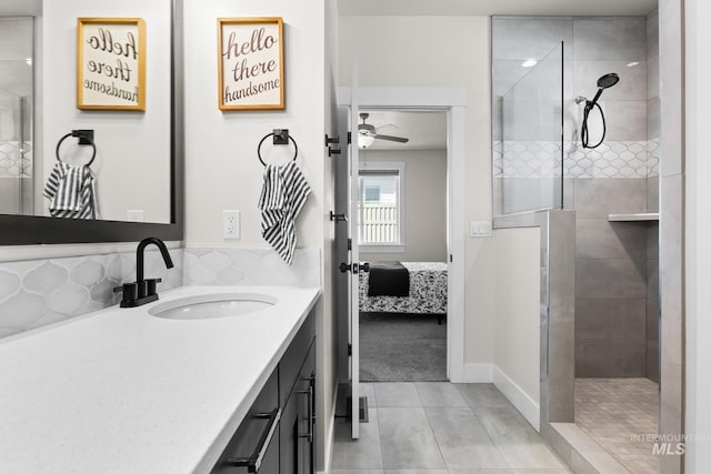 bathroom featuring tile patterned floors, walk in shower, ensuite bathroom, and vanity