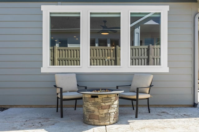 view of patio with a fire pit