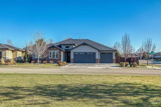 view of front facade featuring a garage and a front lawn