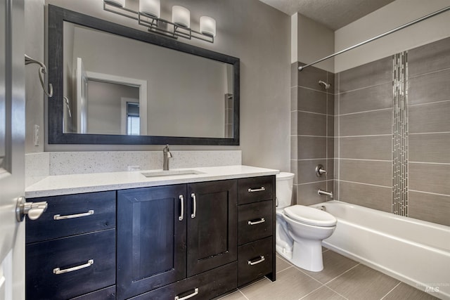 full bathroom with vanity, toilet, and tiled shower / bath