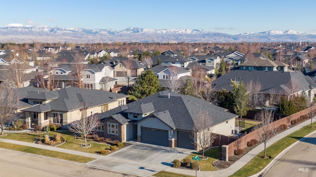 birds eye view of property with a mountain view