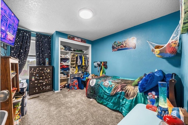 408 Tanoak Cir, Nampa, ID 83686 - carpeted bedroom with a textured ceiling and a closet