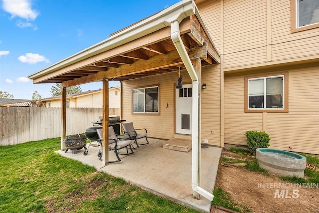 408 Tanoak Cir, Nampa, ID 83686 - view of patio / terrace featuring fence, an outdoor fire pit, and a grill