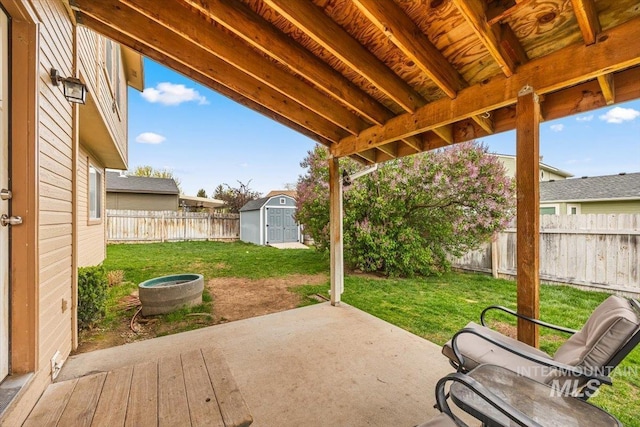 408 Tanoak Cir, Nampa, ID 83686 - view of patio / terrace featuring a fenced backyard, an outbuilding, and a storage shed