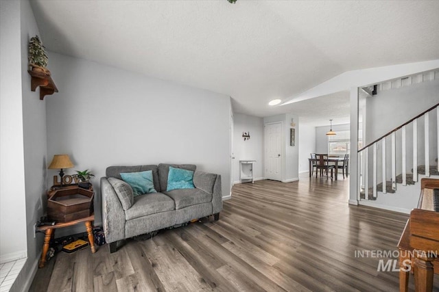 408 Tanoak Cir, Nampa, ID 83686 - living room featuring baseboards, wood finished floors, and stairway