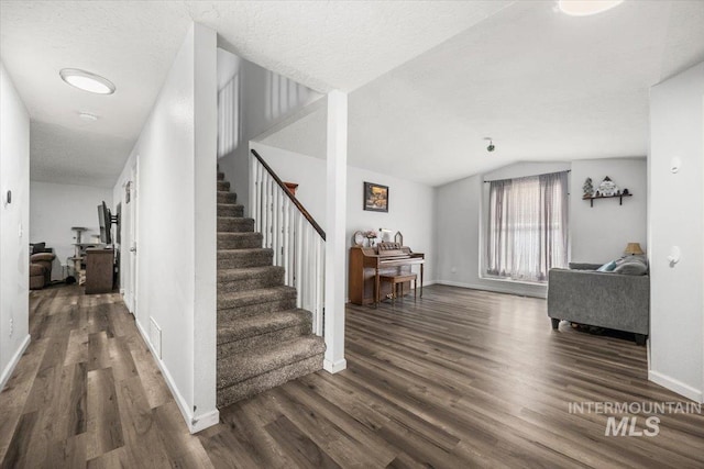 408 Tanoak Cir, Nampa, ID 83686 - stairs with lofted ceiling, baseboards, wood finished floors, and visible vents