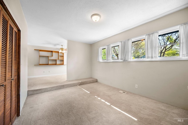 unfurnished bedroom with carpet and a closet