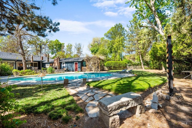 outdoor pool featuring an outdoor structure