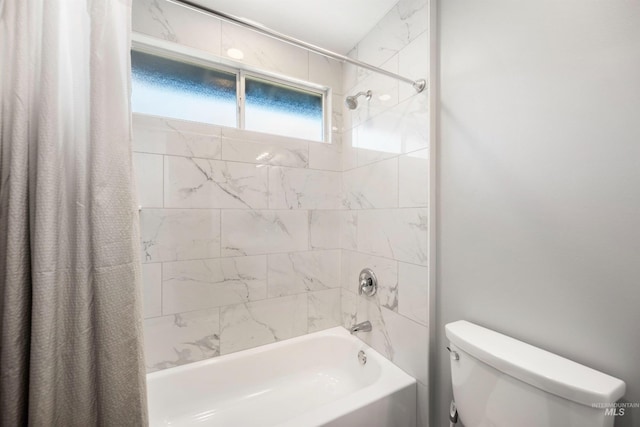 bathroom with shower / bathtub combination with curtain and toilet