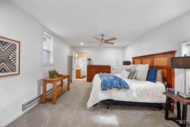 bedroom featuring carpet floors, a baseboard heating unit, ensuite bathroom, a ceiling fan, and recessed lighting