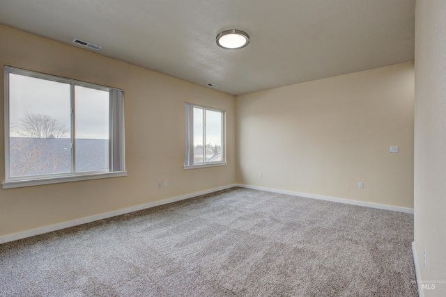 empty room featuring carpet floors