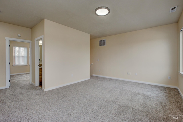 view of carpeted spare room