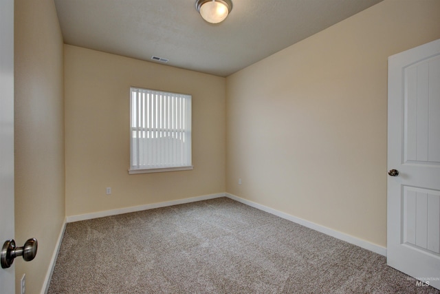 unfurnished room featuring carpet flooring