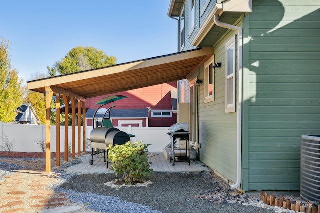 view of property exterior featuring central AC and a patio area