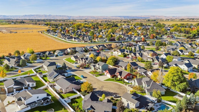 birds eye view of property featuring a mountain view