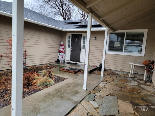 doorway to property with a patio area