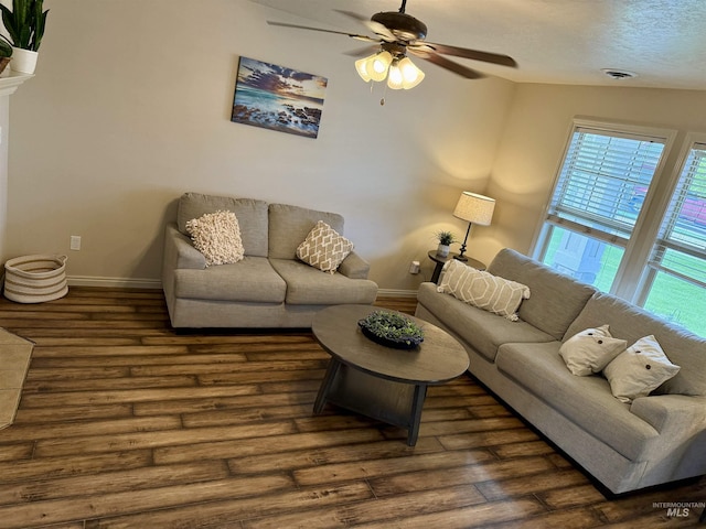 living area with wood finished floors, ceiling fan, and baseboards