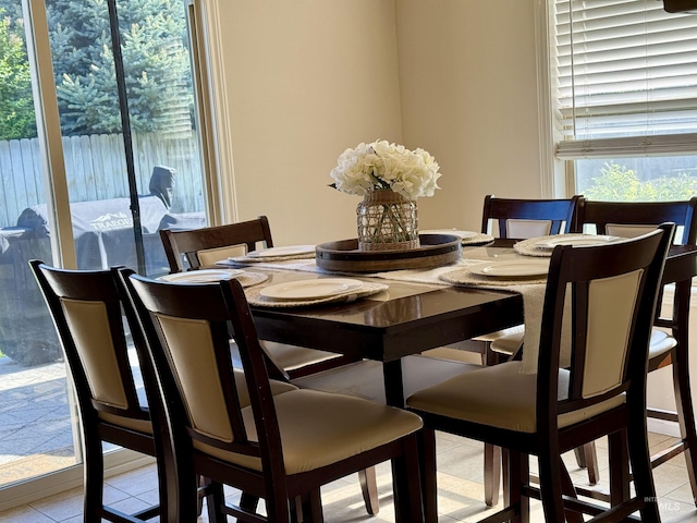 dining space with light tile patterned flooring