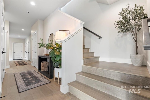 stairway with wood-type flooring