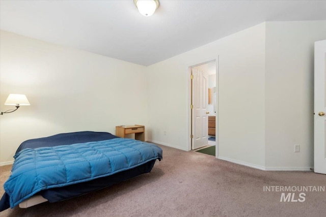 bedroom featuring carpet floors and baseboards