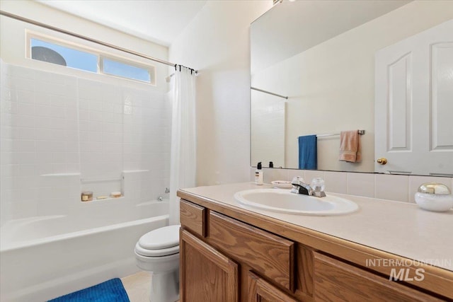 full bath featuring toilet, shower / bath combination with curtain, and vanity