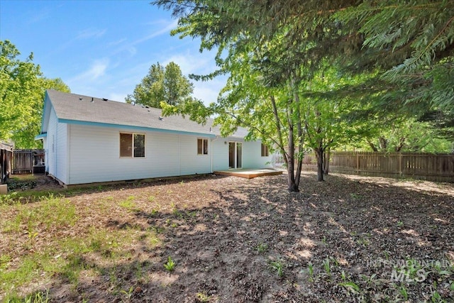 back of house featuring a fenced backyard, a patio area, and central air condition unit