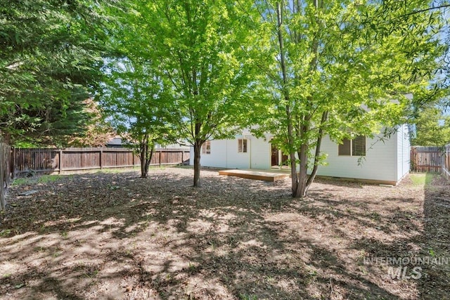 fenced backyard featuring a patio area