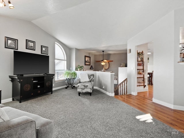 carpeted living room featuring lofted ceiling and ceiling fan