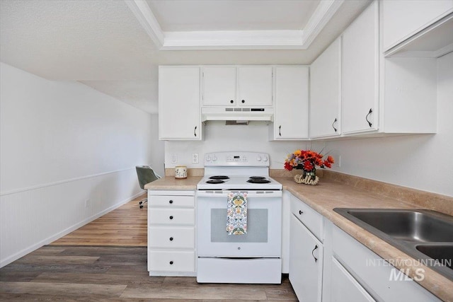 kitchen featuring white electric range, light countertops, a sink, white cabinets, and under cabinet range hood