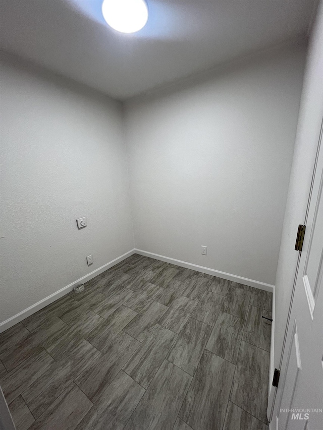 empty room with baseboards