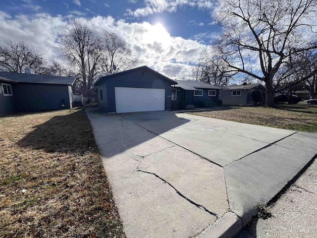 view of front of home with driveway and an attached garage