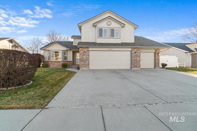 front of property featuring a front yard and a garage