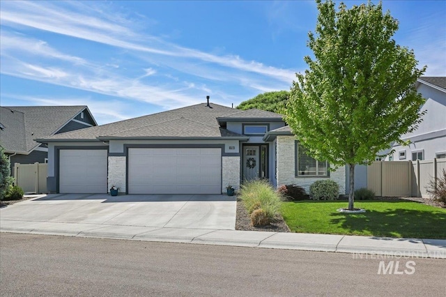 1753 S Kimball Way, Boise, ID 83709 - view of front of property featuring an attached garage, driveway, and roof with shingles