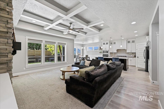 1753 S Kimball Way, Boise, ID 83709 - living area with recessed lighting, baseboards, a ceiling fan, beamed ceiling, and light wood-style flooring