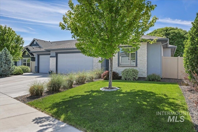 1753 S Kimball Way, Boise, ID 83709 - view of front facade with stone siding, a garage, driveway, and stucco siding