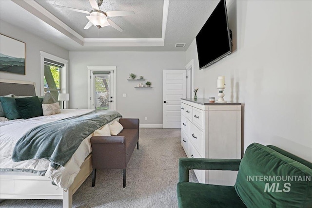 1753 S Kimball Way, Boise, ID 83709 - bedroom featuring a tray ceiling, light carpet, a textured ceiling, baseboards, and ceiling fan