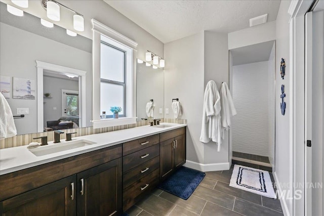 1753 S Kimball Way, Boise, ID 83709 - bathroom with connected bathroom, double vanity, and baseboards