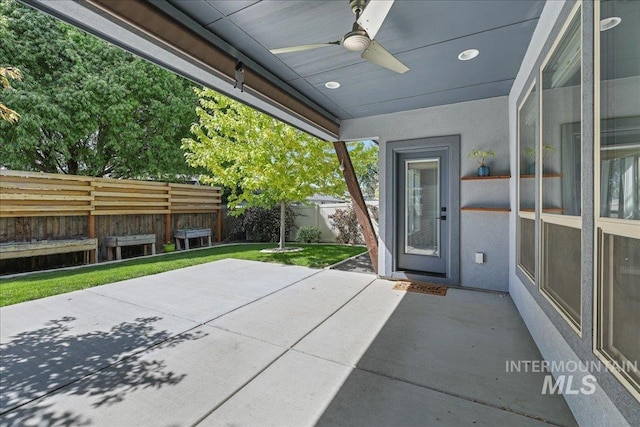 1753 S Kimball Way, Boise, ID 83709 - fenced backyard with ceiling fan and a patio