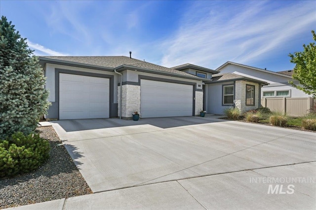 1753 S Kimball Way, Boise, ID 83709 - prairie-style home featuring an attached garage, driveway, and stucco siding