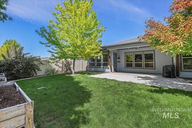 1753 S Kimball Way, Boise, ID 83709 - view of yard featuring a patio