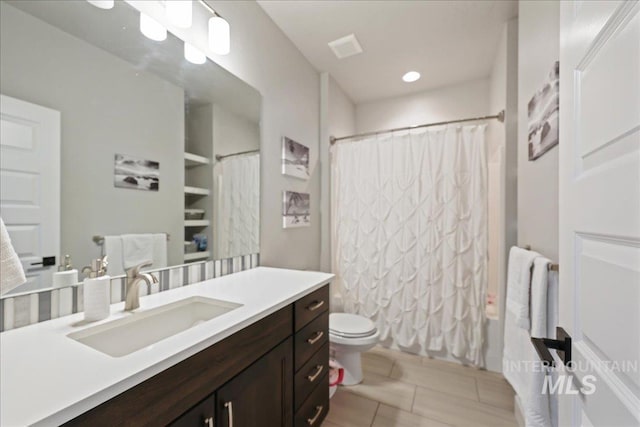 1753 S Kimball Way, Boise, ID 83709 - bathroom featuring vanity, toilet, shower / bath combo, recessed lighting, and tile patterned flooring