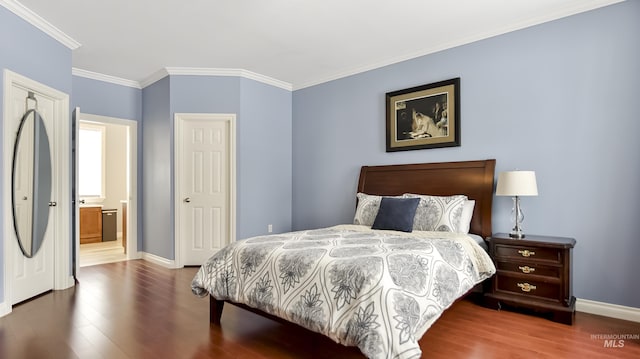 bedroom featuring ornamental molding, wood finished floors, and baseboards