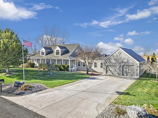 cape cod home with a front lawn and a garage