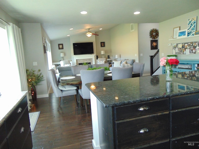 983 S St, Vale, OR 97918 - kitchen featuring ceiling fan, dark wood-type flooring, a fireplace, dark cabinetry, and recessed lighting