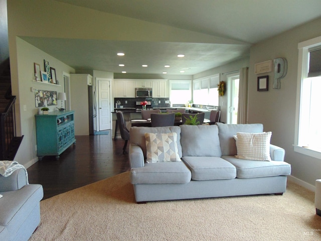 983 S St, Vale, OR 97918 - living room with recessed lighting, plenty of natural light, vaulted ceiling, and dark wood-style flooring